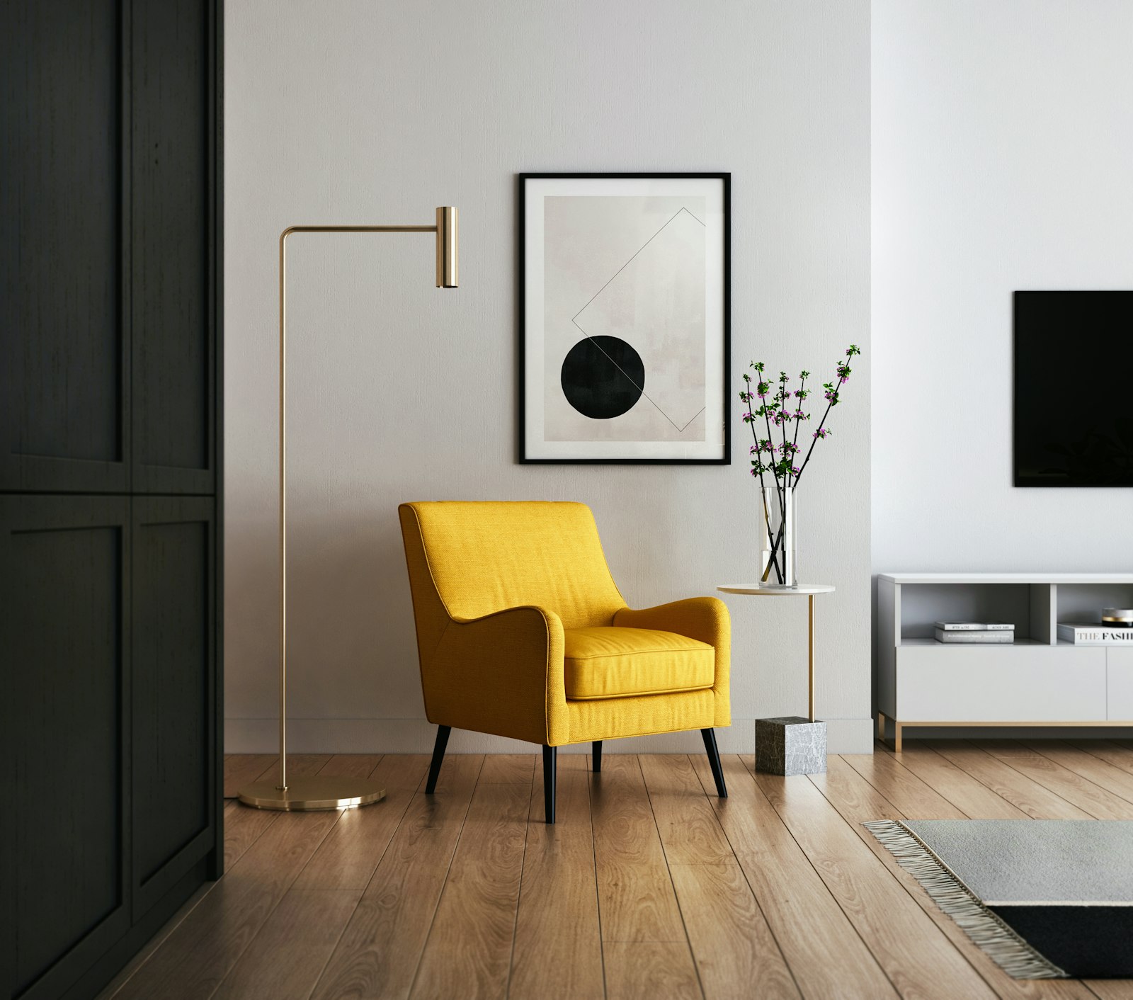 Warm minimal apartment corner with an accent chair, framed art and natural light.